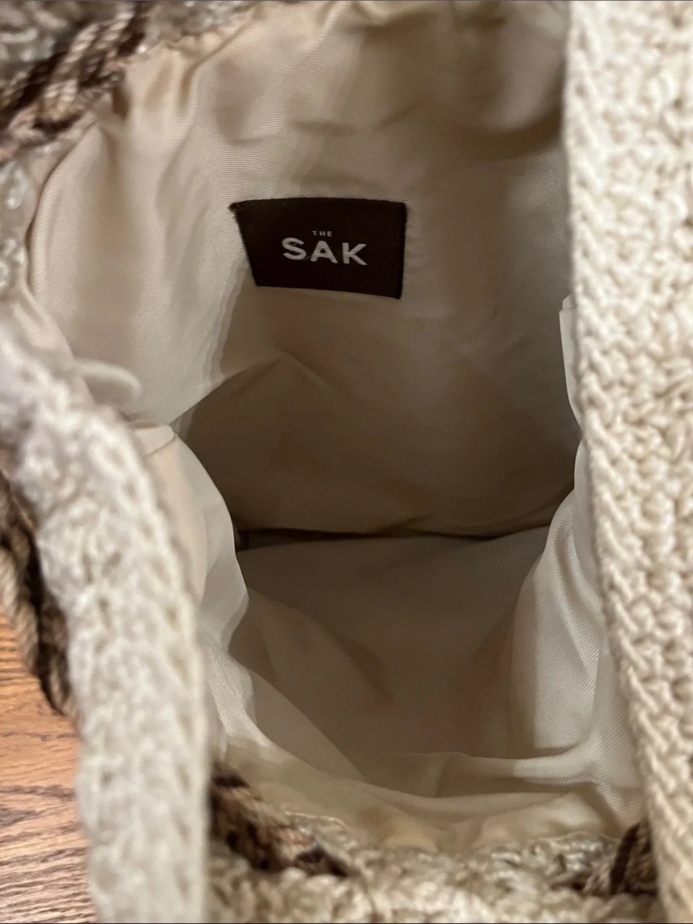 The Sak Crochet Drawstring Backpack Purse in Ivory